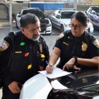 Sergeant Oscar Lucio and Cmdr. Maggie Ochoa make final preparations for "Presents on Patrol"
